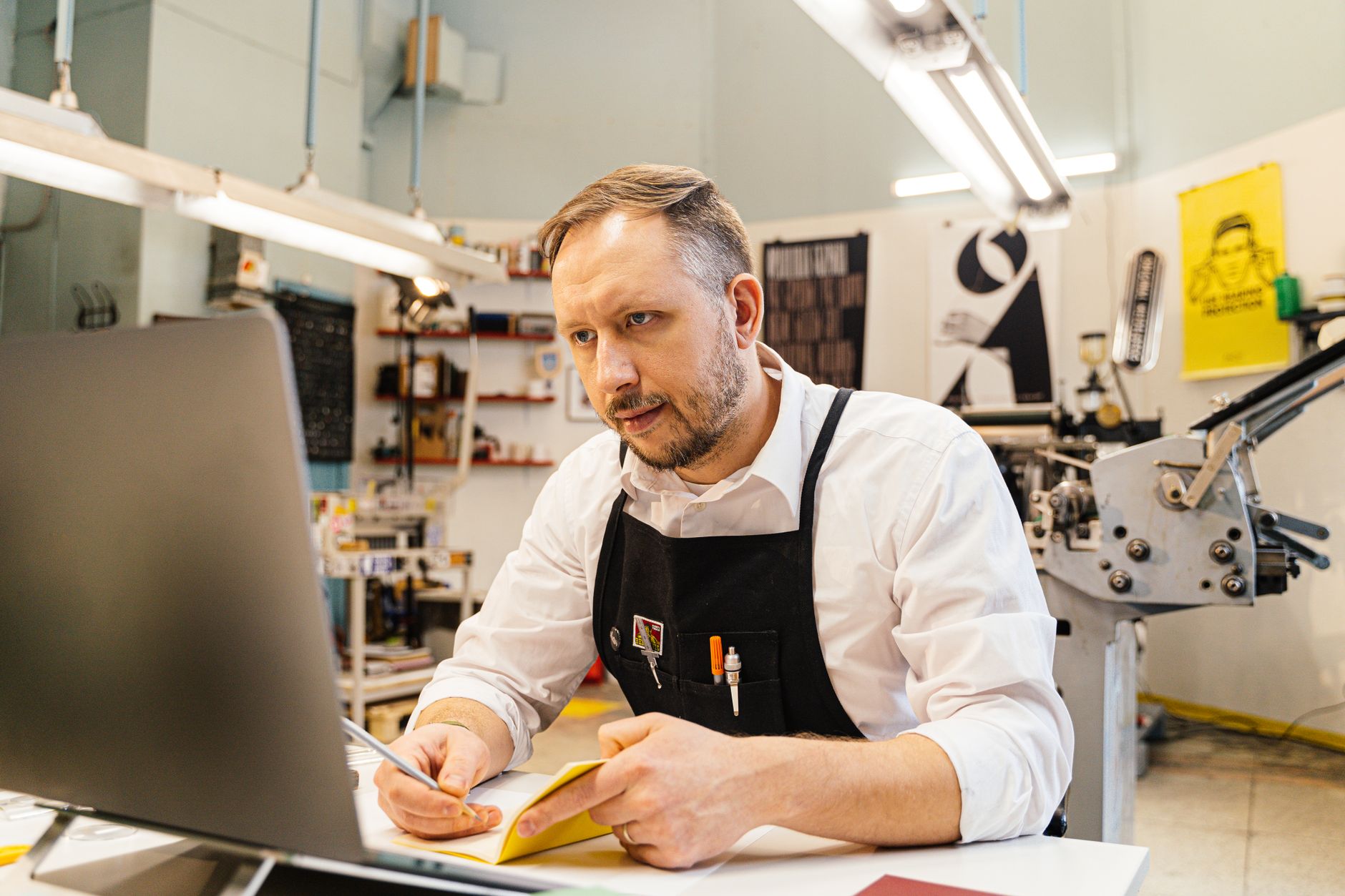small business owner using laptop with automation dashboard