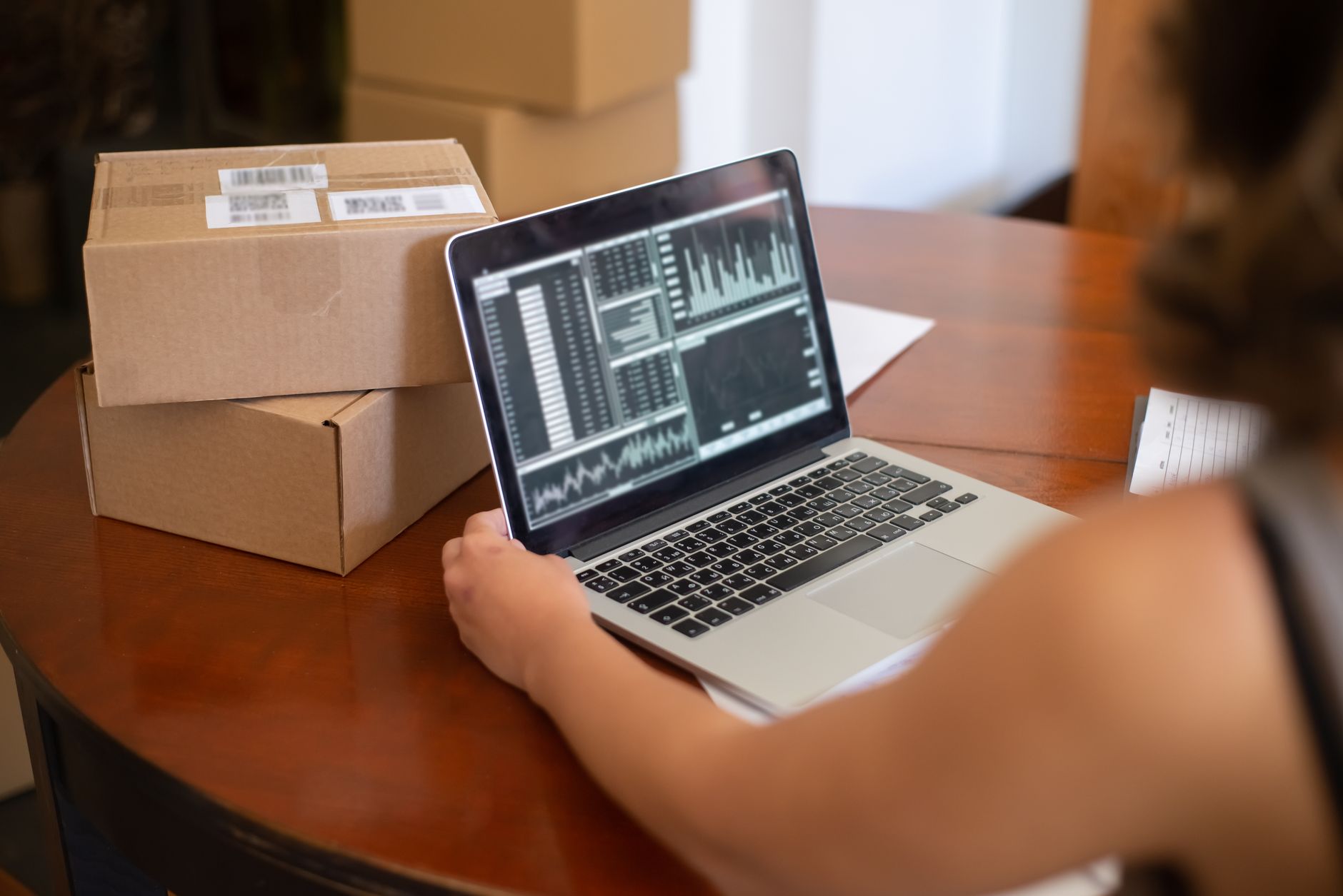 small business owner choosing website platform laptop