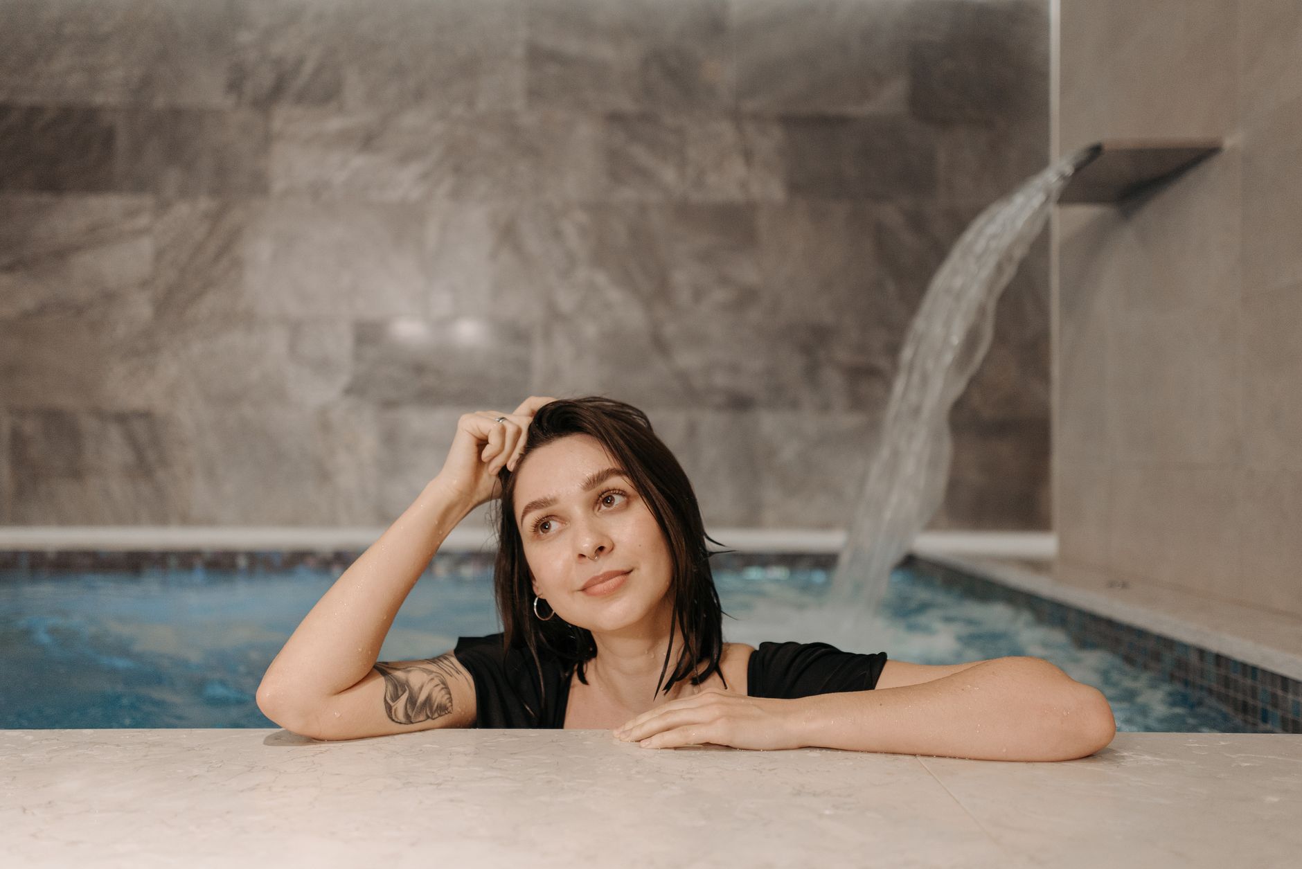 person standing at edge of cold plunge pool mental focus