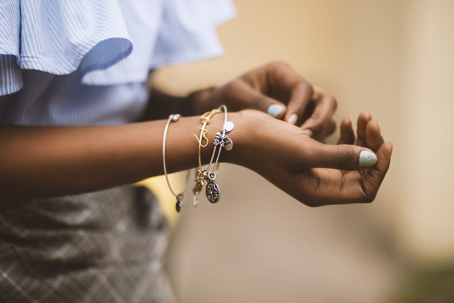 Pandora bracelet with colorful charms on woman wrist