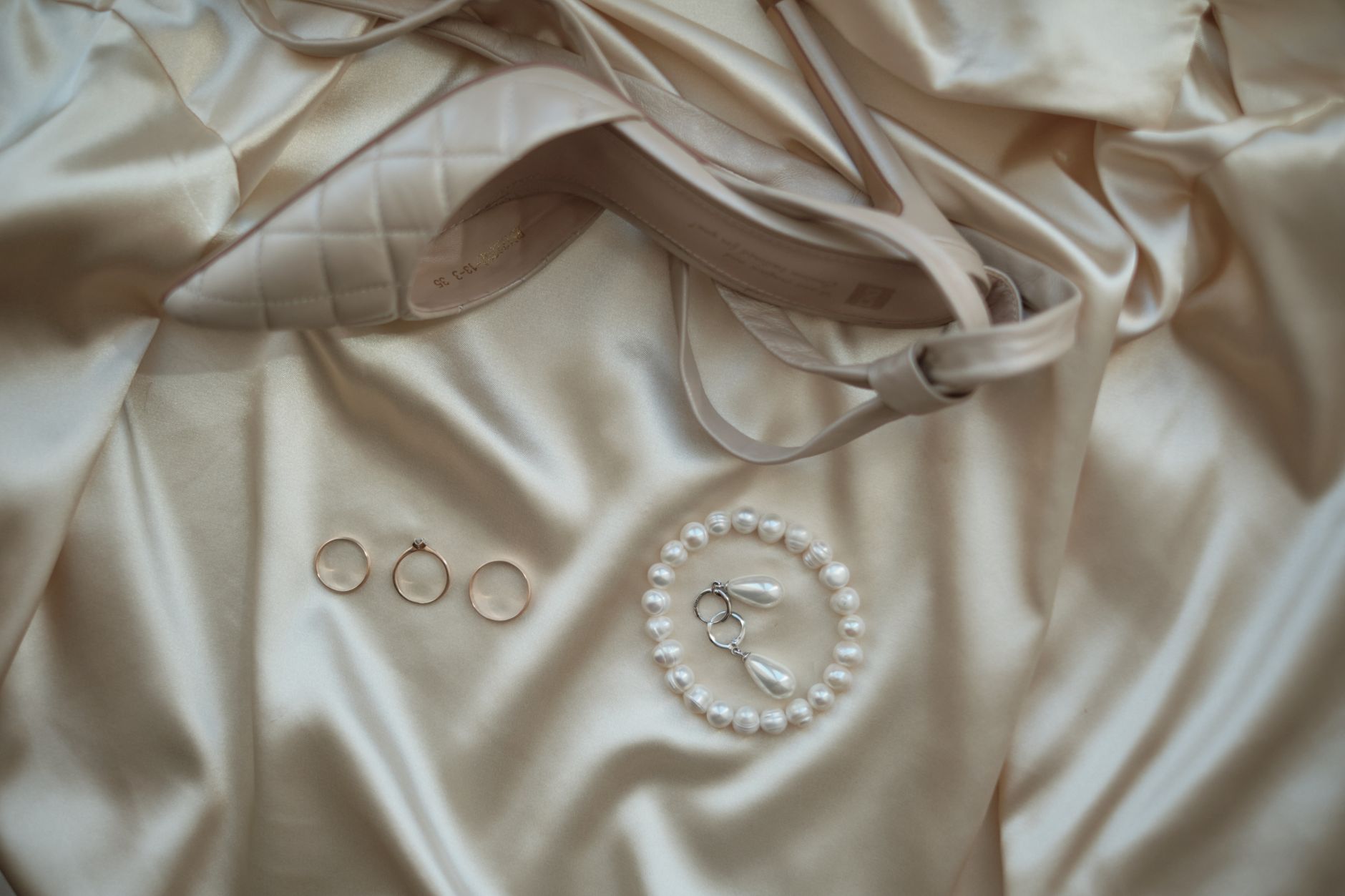 elegant pearl necklace close up on soft fabric