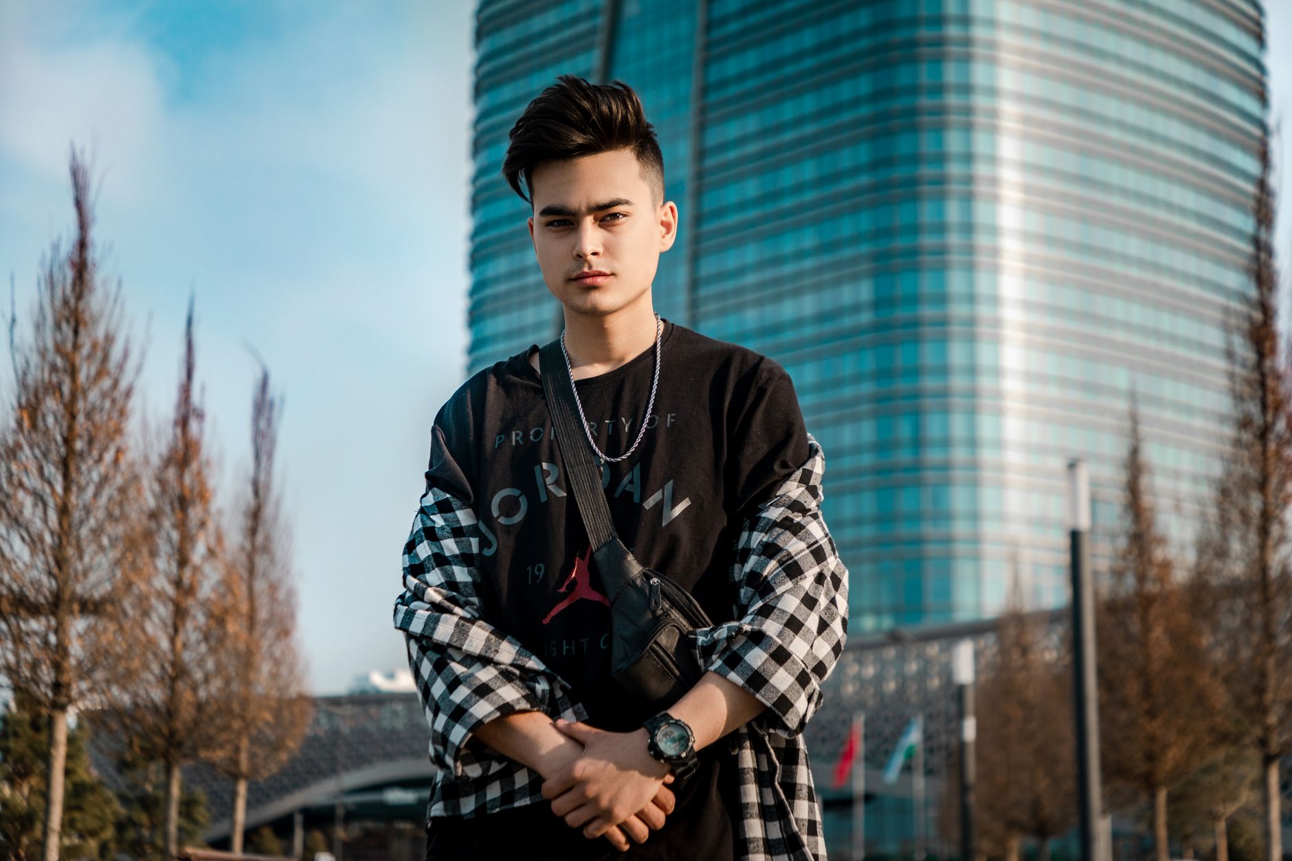 teenage boy wearing simple silver chain necklace