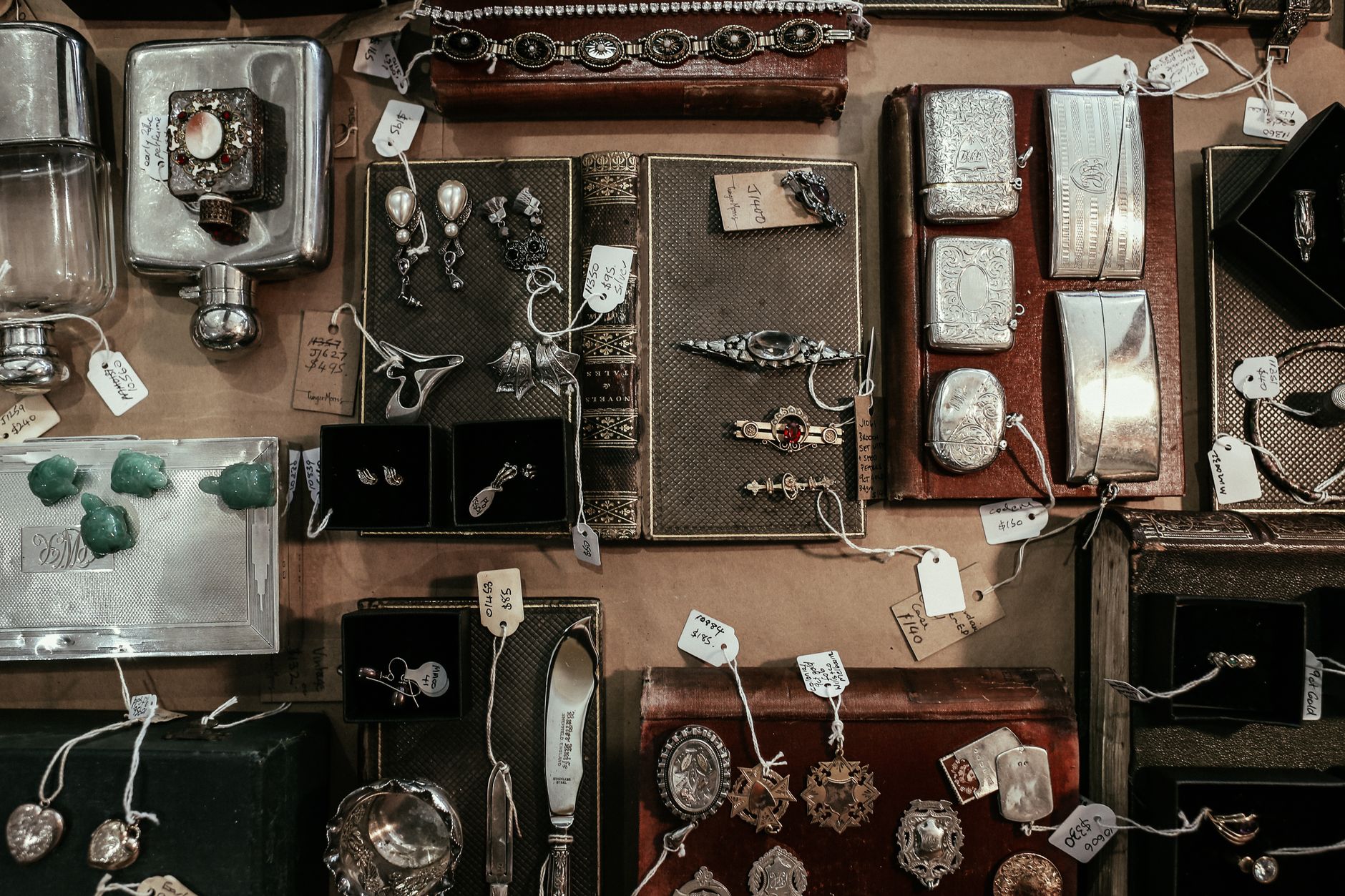 silver jewelry collection necklace bracelet earrings flatlay
