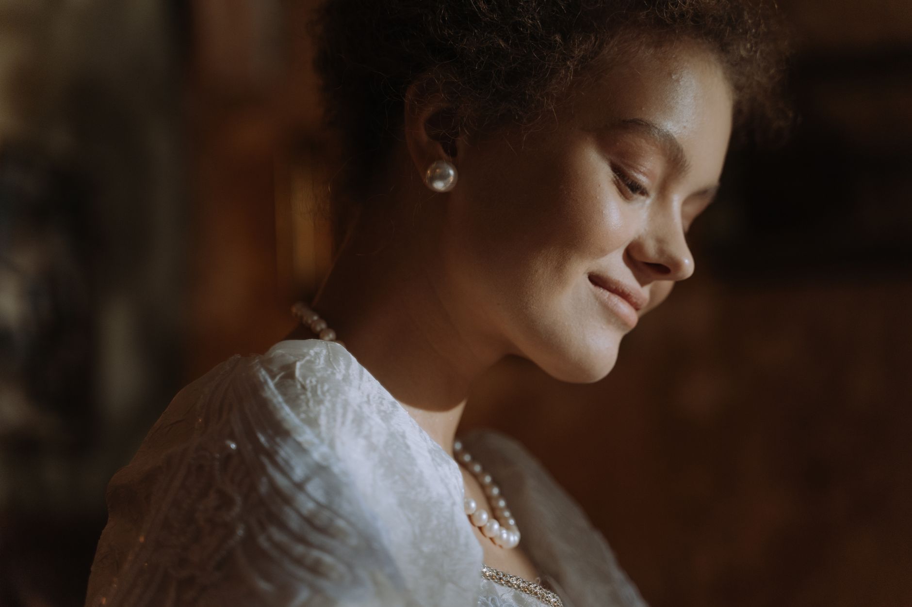 woman wearing pearl earrings elegant style